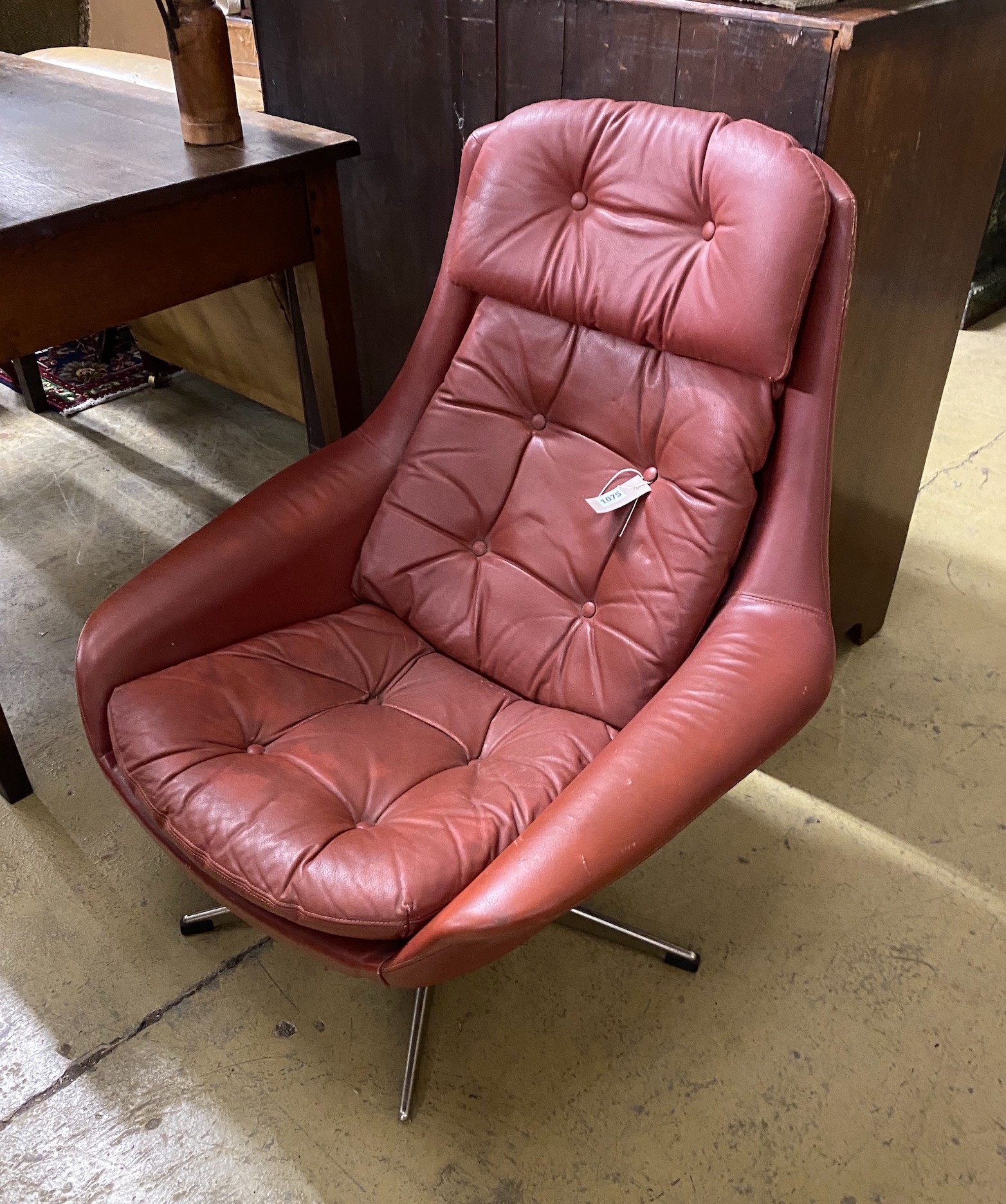 H.W. Klein for Bramin. A Danish burgundy leather swivel chair, width 76cm, depth 84cm, height 88cm